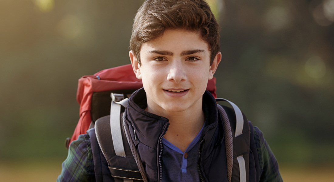portrait shot of a kid with a backpack